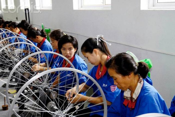 north korean women. North Korean workers at